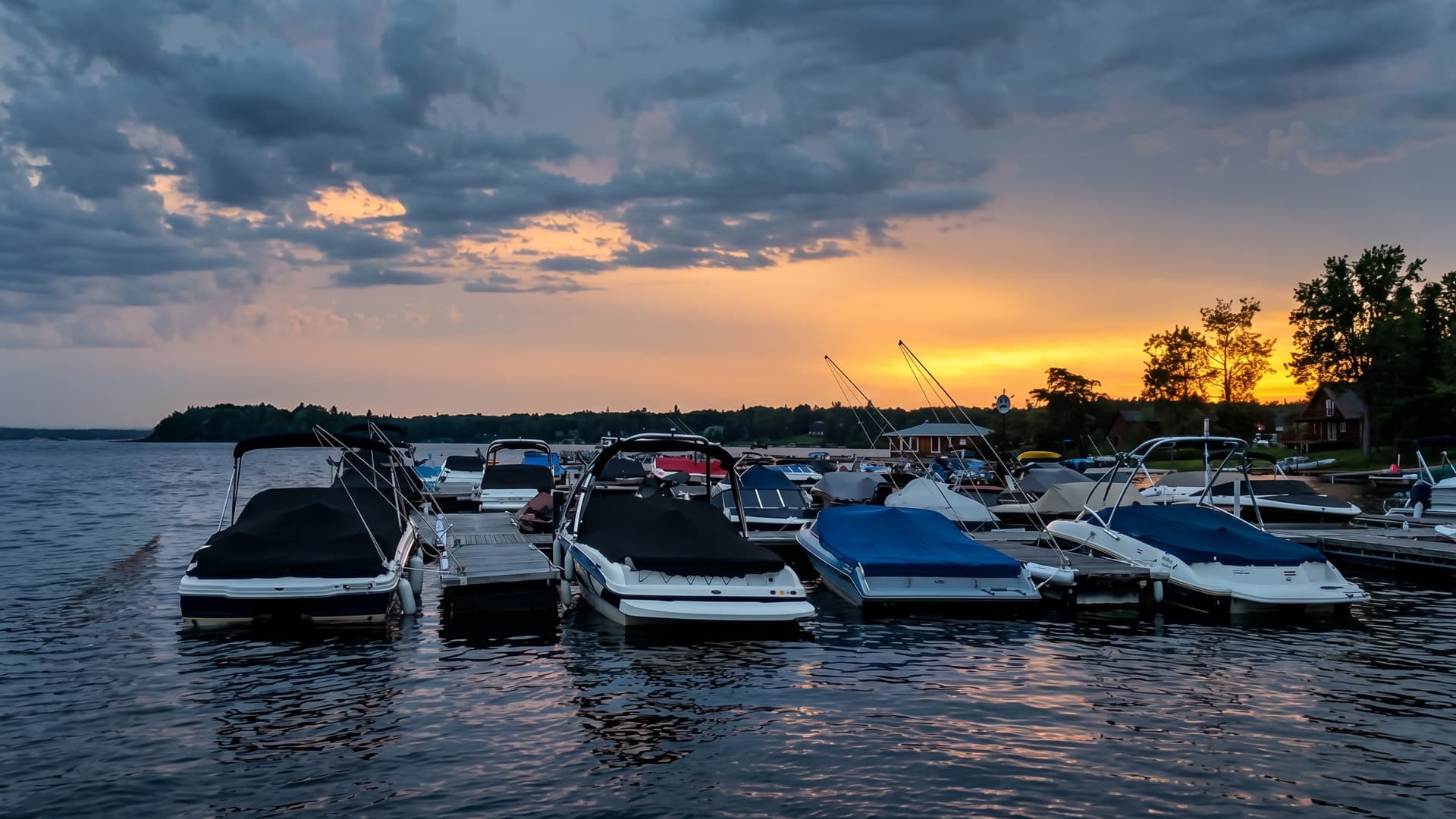 Boats docked at Redden's marina on Longbow Lake near Kenora with rentals and lake access